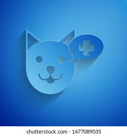 Paper cut Veterinary clinic symbol icon isolated on blue background. Cross with dog veterinary care. Pet First Aid sign. Paper art style. Vector Illustration