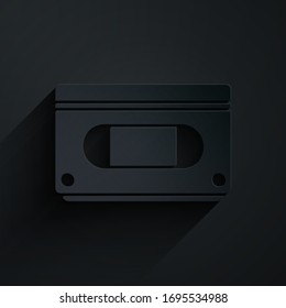Paper cut VHS video cassette tape icon isolated on black background. Paper art style. Vector Illustration