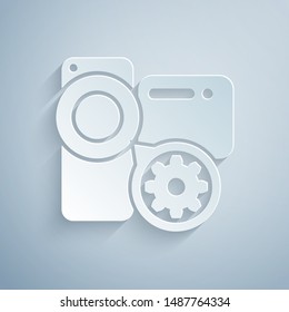 Paper cut Video camera and gear icon isolated on grey background. Adjusting app, service concept, setting options, maintenance, repair, fixing. Paper art style. Vector Illustration