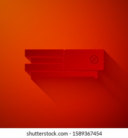 Paper cut Video game console icon isolated on red background. Paper art style. Vector Illustration