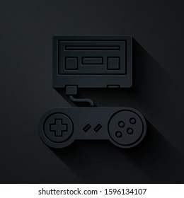 Paper cut Video game console with joystick icon isolated on black background. Paper art style. Vector Illustration