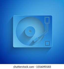 Paper cut Vinyl player with a vinyl disk icon isolated on blue background. Paper art style. Vector Illustration