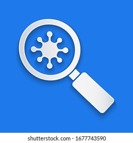 Paper cut Virus under magnifying glass icon isolated on blue background. Corona virus 2019-nCoV. Bacteria and germs, microbe, fungi. Paper art style. Vector Illustration