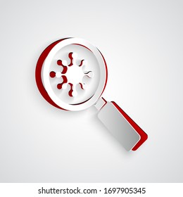 Paper cut Virus under magnifying glass icon isolated on grey background. Corona virus 2019-nCoV. Bacteria and germs, microbe, fungi. Paper art style. Vector Illustration