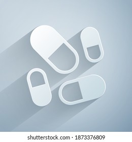 Paper cut Vitamin complex of pill capsule icon isolated on grey background. Healthy lifestyle. Paper art style. Vector