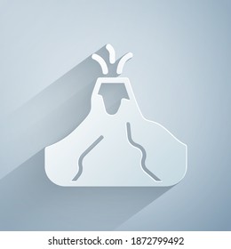 Paper cut Volcano eruption with lava icon isolated on grey background. Paper art style. Vector