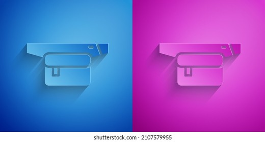 Paper cut Waist bag of banana icon isolated on blue and purple background. Paper art style. Vector