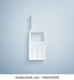 Paper cut Walkie talkie icon isolated on grey background. Portable radio transmitter icon. Radio transceiver sign. Paper art style. Vector Illustration
