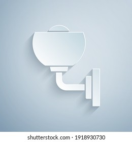 Lámpara de pared de corte de papel o icono espacial aislado en fondo gris. Luz de la lámpara de pared. Estilo de arte de papel. Vector.