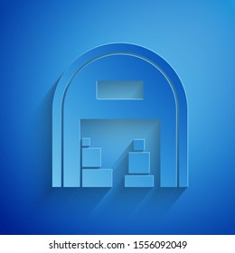 Paper cut Warehouse icon isolated on blue background. Paper art style. Vector Illustration