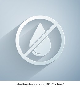 Paper cut Water drop forbidden icon isolated on grey background. No water sign. Paper art style. Vector