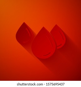 Paper cut Water drop icon isolated on red background. Paper art style. Vector Illustration