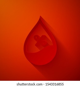 Paper cut Water drop percentage icon isolated on red background. Humidity analysis. Paper art style. Vector Illustration