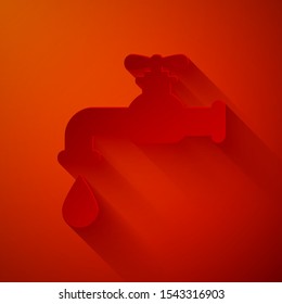 Paper cut Water tap with a falling water drop icon isolated on red background. Paper art style. Vector Illustration