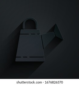 Paper cut Watering can icon isolated on black background. Irrigation symbol. Paper art style. Vector Illustration