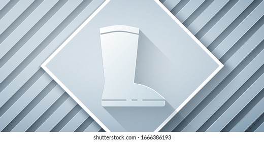 Paper cut Waterproof rubber boot icon isolated on grey background. Gumboots for rainy weather, fishing, gardening. Paper art style. Vector Illustration