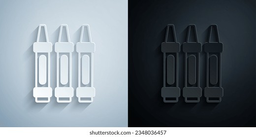 Paper cut Wax crayons for drawing icon isolated on grey and black background. Paper art style. Vector