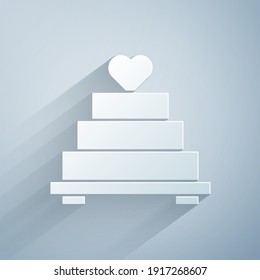 Paper cut Wedding cake with heart icon isolated on grey background. Paper art style. Vector