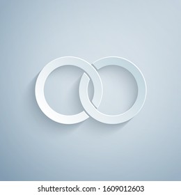 Paper cut Wedding rings icon isolated on grey background. Bride and groom jewelery sign. Marriage icon. Diamond ring icon. Paper art style. Vector Illustration