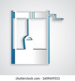 Paper cut Well with a bucket and drinking water icon isolated on grey background. Paper art style. Vector Illustration