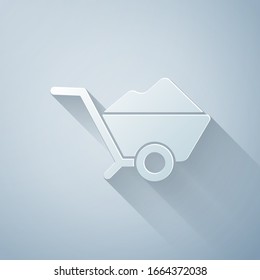 Paper cut Wheelbarrow with dirt icon isolated on grey background. Tool equipment. Agriculture cart wheel farm. Paper art style. Vector Illustration