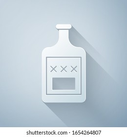 Paper cut Whiskey bottle icon isolated on grey background. Paper art style. Vector Illustration