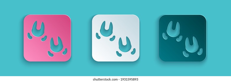 Paper cut Wild boar paw footprint icon isolated on blue background. Paper art style. Vector