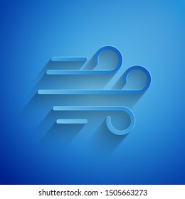 Paper cut Wind icon isolated on blue background. Windy weather. Paper art style. Vector Illustration