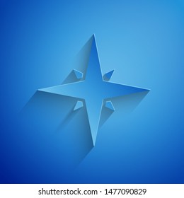Paper cut Wind rose icon isolated on blue background. Compass icon for travel. Navigation design. Paper art style. Vector Illustration