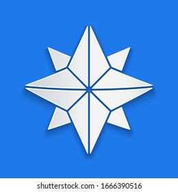 Paper cut Wind rose icon isolated on blue background. Compass icon for travel. Navigation design. Paper art style. Vector Illustration