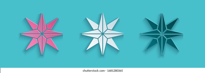 Paper cut Wind rose icon isolated on blue background. Compass icon for travel. Navigation design. Paper art style. Vector Illustration