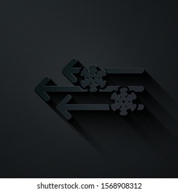 Paper cut Wind and snow icon isolated on black background. Windy weather. Paper art style. Vector Illustration