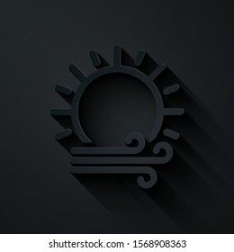 Paper cut Wind and sun icon isolated on black background. Windy weather. Paper art style. Vector Illustration
