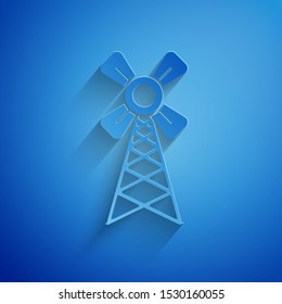Paper cut Windmill icon isolated on blue background. Paper art style. Vector Illustration