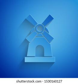 Paper cut Windmill icon isolated on blue background. Paper art style. Vector Illustration