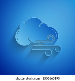 Paper cut Windy weather icon isolated on blue background. Cloud and wind. Paper art style. Vector Illustration