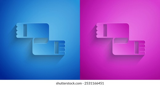 Paper cut Winter scarf icon isolated on blue and purple background. Paper art style. Vector