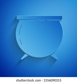 Paper cut Witch cauldron icon isolated on blue background. Happy Saint Patricks day. Paper art style. Vector Illustration
