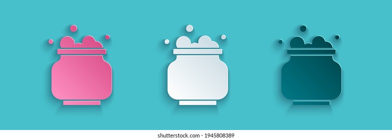 Paper cut Witch cauldron icon isolated on blue background. Happy Halloween party. Paper art style. Vector