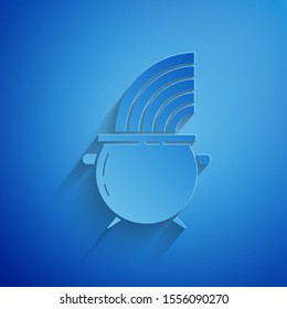 Paper cut Witch cauldron and rainbow icon isolated on blue background. Happy Saint Patricks day. Paper art style. Vector Illustration