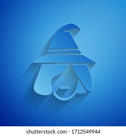 Paper cut Witch icon isolated on blue background. Happy Halloween party. Paper art style. Vector Illustration