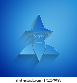 Paper cut Wizard warlock icon isolated on blue background. Paper art style. Vector Illustration