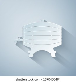 Paper cut Wooden barrel on rack with stopcock icon isolated on grey background. Paper art style. Vector Illustration