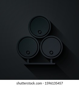 Paper cut Wooden barrels icon isolated on black background. Alcohol barrel, drink container, wooden keg for beer, whiskey, wine. Paper art style. Vector Illustration