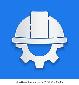 Paper cut Worker safety helmet and gear icon isolated on blue background. Paper art style. Vector Illustration