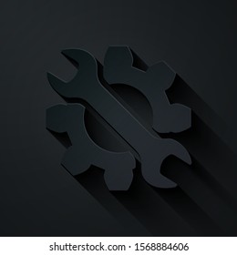 Paper cut Wrench and gear icon isolated on black background. Adjusting, service, setting, maintenance, repair, fixing. Paper art style. Vector Illustration