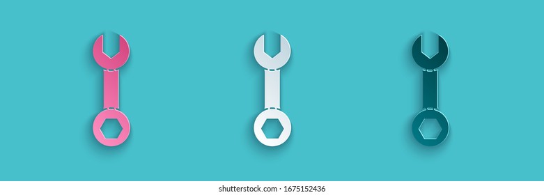Paper cut Wrench spanner icon isolated on blue background. Paper art style. Vector Illustration