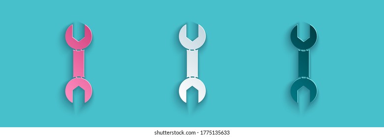 Paper cut Wrench spanner icon isolated on blue background. Paper art style. Vector Illustration