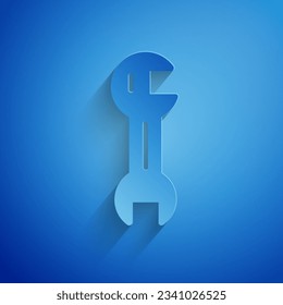 Paper cut Wrench spanner icon isolated on blue background. Paper art style. Vector