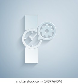 Paper cut Wrist watch and gear icon isolated on grey background. Adjusting app, service concept, setting options, maintenance, repair, fixing. Paper art style. Vector Illustration